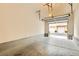 View of the open, empty garage showcasing ample space and functionality at 251 S Green Valley Pkwy # 1311, Henderson, NV 89012