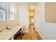 Hallway with wood floors, multiple windows, and a built in desk at 251 S Green Valley Pkwy # 1311, Henderson, NV 89012