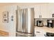 The kitchen features stainless steel appliances, white cabinets, and bright countertops at 251 S Green Valley Pkwy # 1311, Henderson, NV 89012