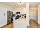 Modern kitchen features white cabinets, stainless steel appliances, and light countertops at 251 S Green Valley Pkwy # 1311, Henderson, NV 89012