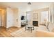 Comfortable living room featuring a fireplace, hardwood floors, and ample seating at 251 S Green Valley Pkwy # 1311, Henderson, NV 89012