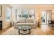 Bright living room featuring a comfortable sofa, area rug, and large windows for natural light at 251 S Green Valley Pkwy # 1311, Henderson, NV 89012