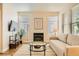 Cozy living room boasts a decorative fireplace, neutral paint, and wood-style flooring at 251 S Green Valley Pkwy # 1311, Henderson, NV 89012
