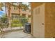 View of patio with neutral siding, HVAC unit, greenery, and the community beyond at 251 S Green Valley Pkwy # 1311, Henderson, NV 89012