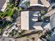 Aerial view of a well-maintained property featuring lush landscaping, a private hot tub, and outdoor living spaces at 2612 Dearport Ct, Henderson, NV 89052