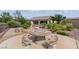Well-kept backyard patio with a mosaic picnic table and desert landscaping at 2612 Dearport Ct, Henderson, NV 89052