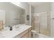 Bathroom with a stand-up shower, frameless shower doors and bright, white vanity at 2612 Dearport Ct, Henderson, NV 89052