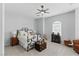 Cozy bedroom with a decorative wrought iron bed frame and neutral color palette at 2612 Dearport Ct, Henderson, NV 89052