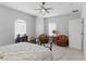 Comfortable bedroom featuring large windows and two chairs for a relaxing retreat at 2612 Dearport Ct, Henderson, NV 89052