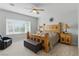 Stylish bedroom features a wooden bed, large windows, and neutral decor at 2612 Dearport Ct, Henderson, NV 89052