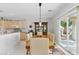 Bright dining room features a large table, comfortable chairs, and sliding glass doors at 2612 Dearport Ct, Henderson, NV 89052