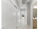 Bright hallway with tile flooring, closet, and bathroom access at 2612 Dearport Ct, Henderson, NV 89052