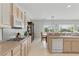 This kitchen features sleek countertops, a gas range and updated, white appliances at 2612 Dearport Ct, Henderson, NV 89052