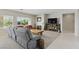Bright, open-concept living room features neutral colors, a fireplace, and stylish furniture at 2612 Dearport Ct, Henderson, NV 89052