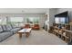 Spacious living room with natural light, neutral colors, and cozy furniture arrangement at 2612 Dearport Ct, Henderson, NV 89052