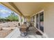 Covered patio with outdoor dining set, sliding glass doors, and landscaped backyard at 2612 Dearport Ct, Henderson, NV 89052