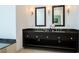 Bathroom vanity with double sinks, granite countertop, and dark wood cabinetry at 2700 S Las Vegas Blvd # 4305, Las Vegas, NV 89109