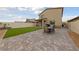 Backyard features a large patio, seating and a well-manicured lawn at 2729 Pavehawk Way, Las Vegas, NV 89156