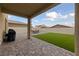 Outdoor living space featuring a grill, patio, and artificial grass at 2729 Pavehawk Way, Las Vegas, NV 89156