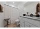 Clean bathroom features a white vanity, granite countertop, and shower with curtain at 2729 Pavehawk Way, Las Vegas, NV 89156