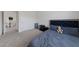 Cozy bedroom with a plush bed, soft carpet, and an open doorway at 2729 Pavehawk Way, Las Vegas, NV 89156