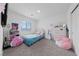 Cheerful bedroom with plush carpet and decor creates a cozy, playful space at 2729 Pavehawk Way, Las Vegas, NV 89156