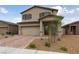 Charming two-story home featuring a neutral color scheme and a well-maintained, inviting front yard at 2729 Pavehawk Way, Las Vegas, NV 89156