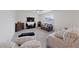 Cozy living room featuring a fireplace, large TV, and comfortable seating at 2729 Pavehawk Way, Las Vegas, NV 89156