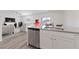 Stylish kitchen with stainless steel appliances and open layout to the living room at 2729 Pavehawk Way, Las Vegas, NV 89156