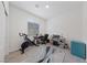 Well-lit home office space featuring a desk, chair, and modern exercise bike at 2729 Pavehawk Way, Las Vegas, NV 89156