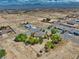 Quaint home nestled on a spacious lot with lush trees in a serene residential setting at 291 E Hickory St, Pahrump, NV 89048