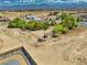 Aerial view of a residential property in a quiet neighborhood with mountains in the background at 291 E Hickory St, Pahrump, NV 89048