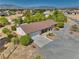 Charming single-story home with mature trees, a quaint front yard, and gravel driveway on a spacious lot at 291 E Hickory St, Pahrump, NV 89048