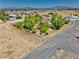 Aerial view of a single Gathering house with mature trees in a quiet neighborhood at 291 E Hickory St, Pahrump, NV 89048