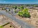 Aerial view of a single Gathering house with mature trees in a residential neighborhood at 291 E Hickory St, Pahrump, NV 89048