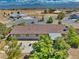 Secluded backyard featuring a concrete patio, mature trees, and ample space for outdoor activities at 291 E Hickory St, Pahrump, NV 89048