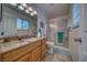 Bright bathroom features granite counters, framed mirror and walk-in shower at 291 E Hickory St, Pahrump, NV 89048