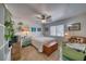 Relaxing bedroom featuring a ceiling fan, window view, and charming decor at 291 E Hickory St, Pahrump, NV 89048