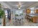 Bright dining area with access to the back patio, ceiling fan and tile floors at 291 E Hickory St, Pahrump, NV 89048