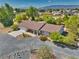 Well-maintained single-story home with lush front yard landscaping and an attached two-car garage at 291 E Hickory St, Pahrump, NV 89048