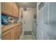 Functional laundry room with storage cabinets and direct access from the house at 291 E Hickory St, Pahrump, NV 89048