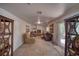 Bright living room featuring a cozy fireplace and sliding glass door to the outside at 291 E Hickory St, Pahrump, NV 89048