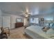 Large main bedroom featuring a ceiling fan, natural light, and comfortable furniture at 291 E Hickory St, Pahrump, NV 89048