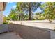 Cozy balcony space with relaxing views of the green landscaping and mature trees at 3150 Soft Breezes Dr # 1216, Las Vegas, NV 89128