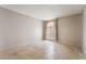 Bright bedroom with tile flooring and a large window providing ample natural light at 3150 Soft Breezes Dr # 1216, Las Vegas, NV 89128