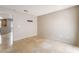 An additional view of the neutrally painted bedroom with tile floors and ample space at 3150 Soft Breezes Dr # 1216, Las Vegas, NV 89128