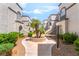 Exterior view featuring the well-kept grounds and the building's architectural elements at 3150 Soft Breezes Dr # 1216, Las Vegas, NV 89128
