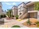 Exterior view showcasing the building's architectural details, landscaping, and walkway at 3150 Soft Breezes Dr # 1216, Las Vegas, NV 89128