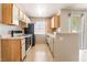 Bright kitchen features tile floors and plenty of cabinet space at 3150 Soft Breezes Dr # 1216, Las Vegas, NV 89128