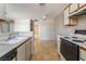 Kitchen with oven, dishwasher, sink, and views of living room at 3150 Soft Breezes Dr # 1216, Las Vegas, NV 89128